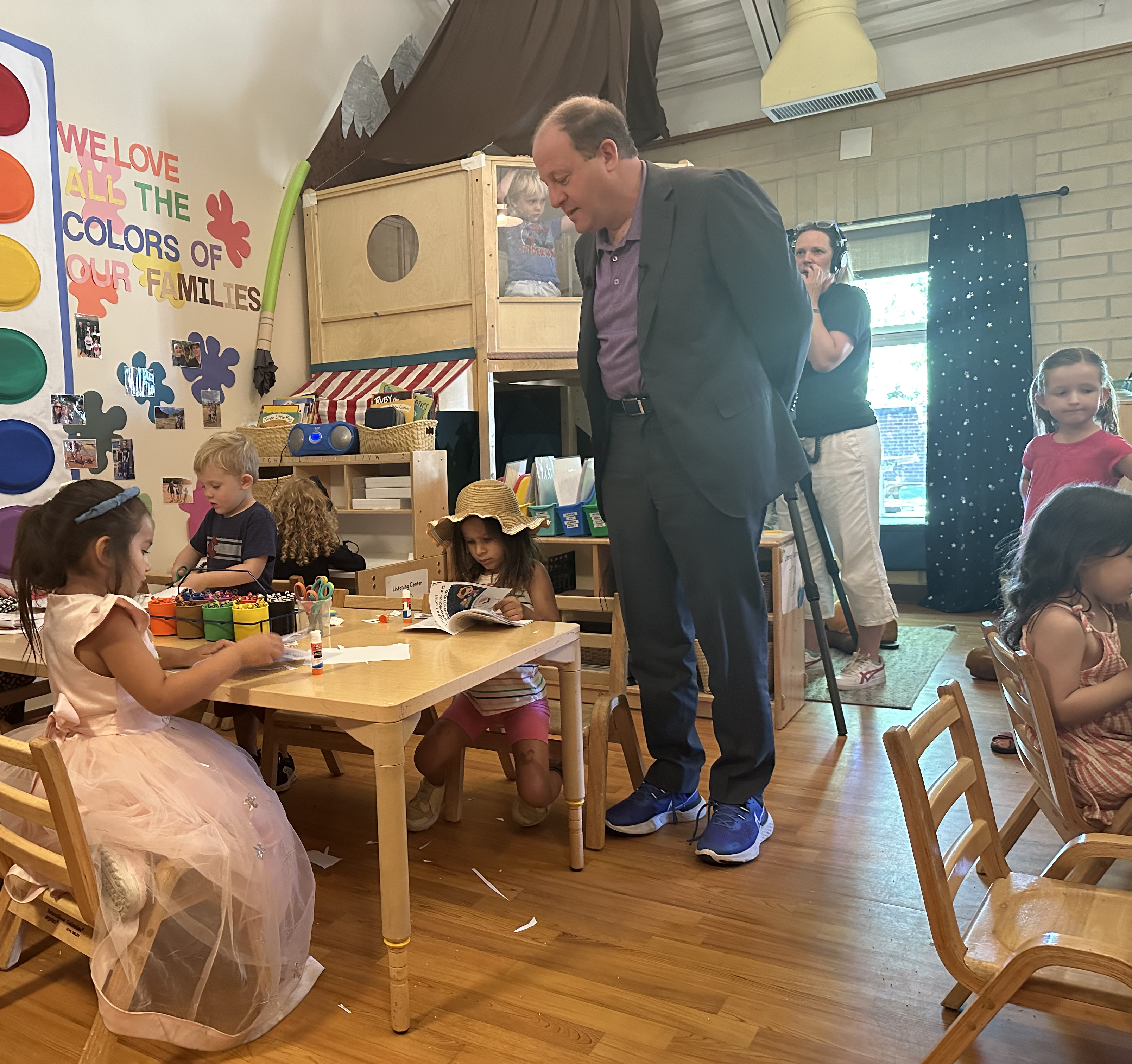 Jared Polis in early learning classroom with students