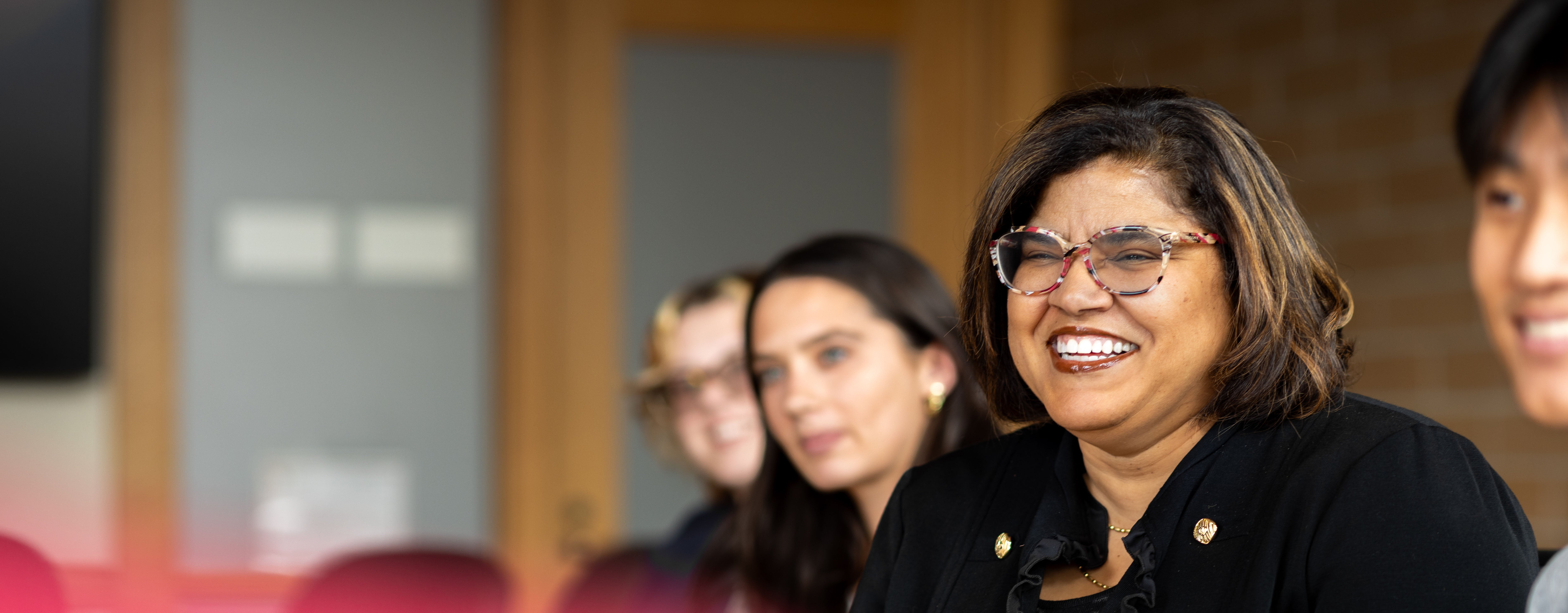students smile in a Morgridge classroom discussion