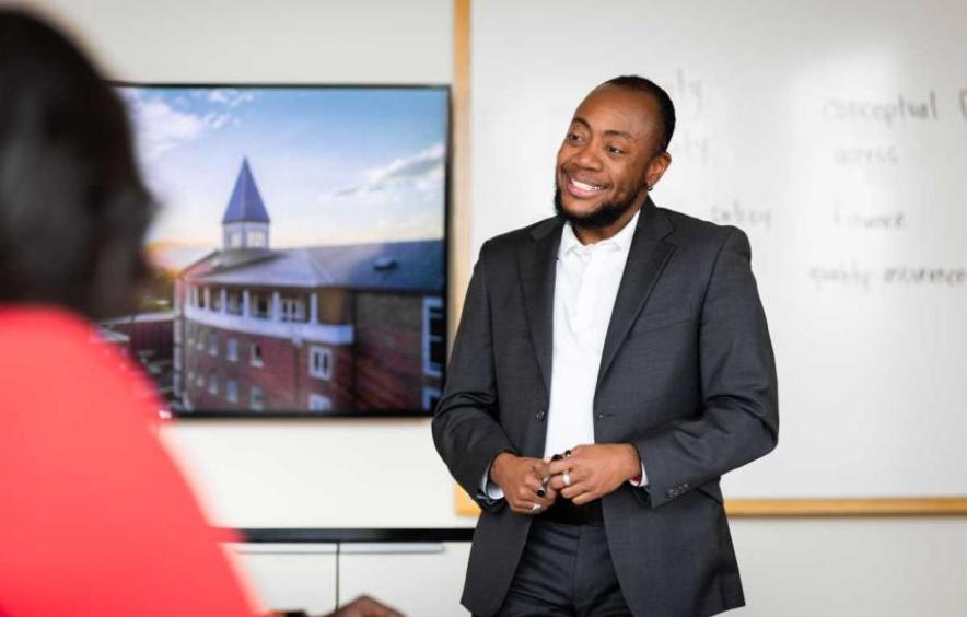 D-L Stewart smiles during a lecture