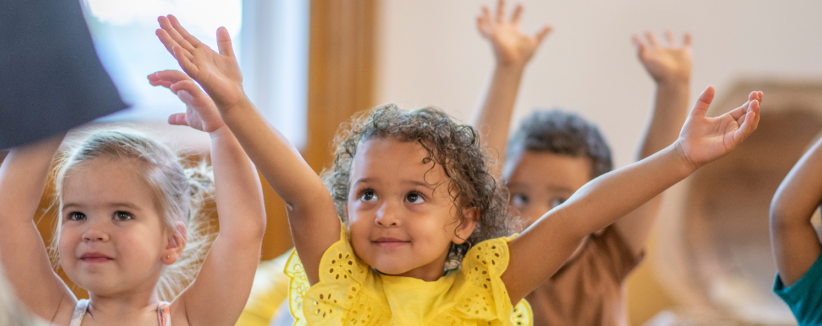 preschoolers holding hands up